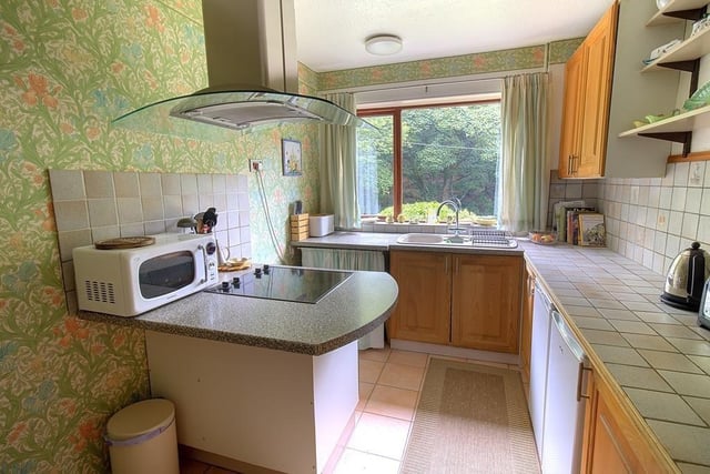The kitchen has fitted units, and a small island with built in oven, hob, and extractor canopy. From the dining room are patio doors to the garden.
For more details, call 01706 754949.