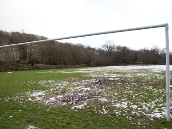 Snow and mud covered football pitch at Luddendenfoot