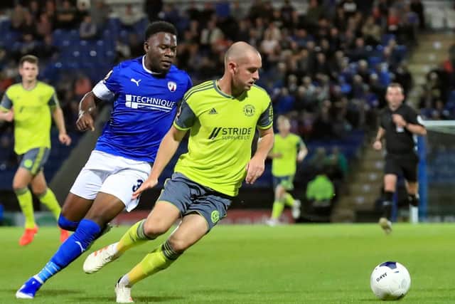Mkle Fondop of Chesterfield and Town's Josh Staunton. Chesterfield 2-3 FC Halifax Town. Picture: John Hobson/AHPIX LTD.