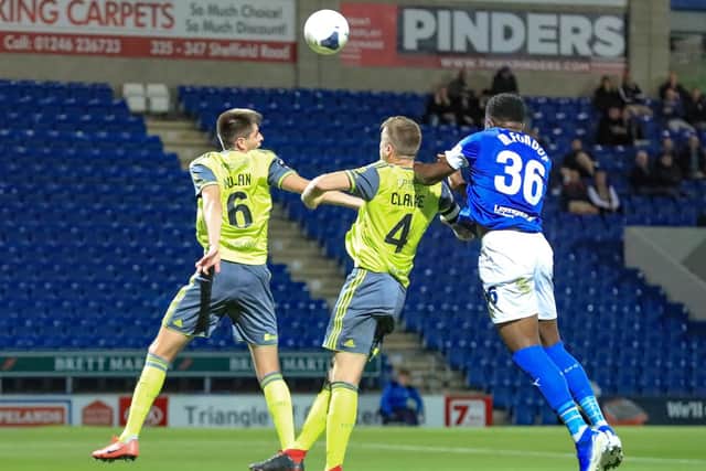 Town's Nathan Clarke and Chesterfield's Mike Fondop challenge for a header. Chesterfield 2-3 FC Halifax Town. Picture: John Hobson/AHPIX LTD.