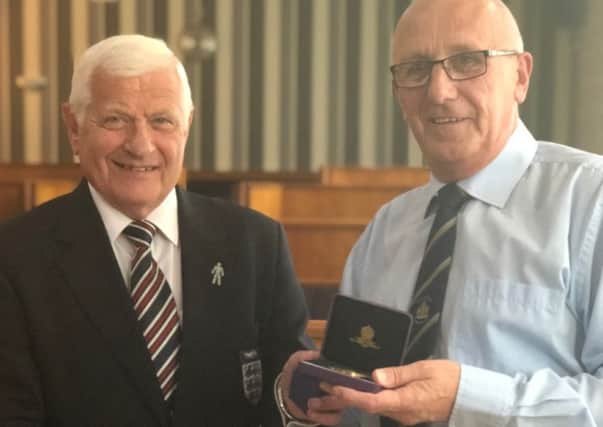 David Rattigan receives 50 year service award from Barry Chaplin on the West Riding County FA