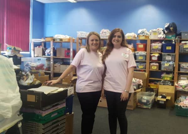 Emmajayne Carter with her daughter Paige at the Mothershare stockroom.
