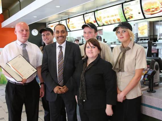 Pritpal Singh and staff in the Halifax town centre outlet