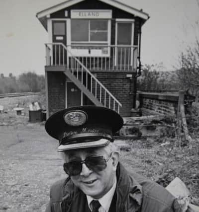 Former Elland Railway Station Master, Norman Kemp, 80, pictured in the 1990's in front of the since demolished Elland station