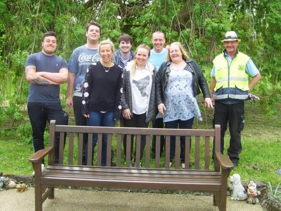 The group embarked on the challenge to paint and restore benches