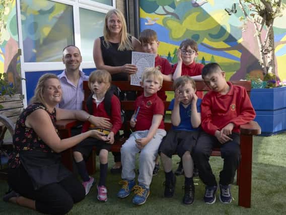 Woodbank School, Luddenden has been awarded the Art Mark. Staff Katherine Gibson, Richard Rawson and Jenna Port with some of pupils.