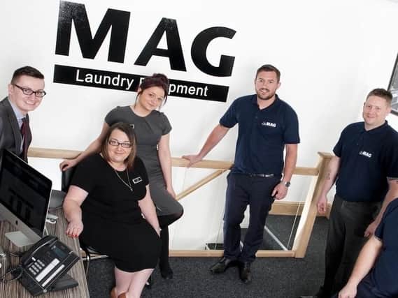 The team at MAG Laundry Equipment,