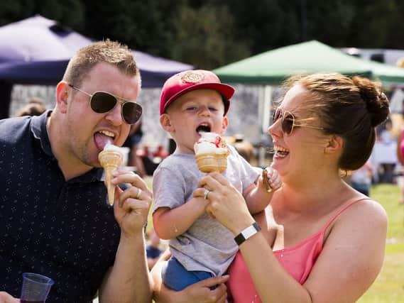 The Brook family; Aaron, Xander and Suzanne, enjoy an ice cream in the sun.