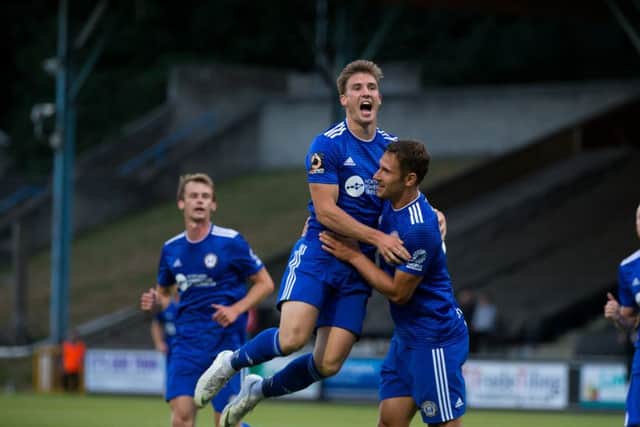 Town celebrate a goal against Barrow at the Shay