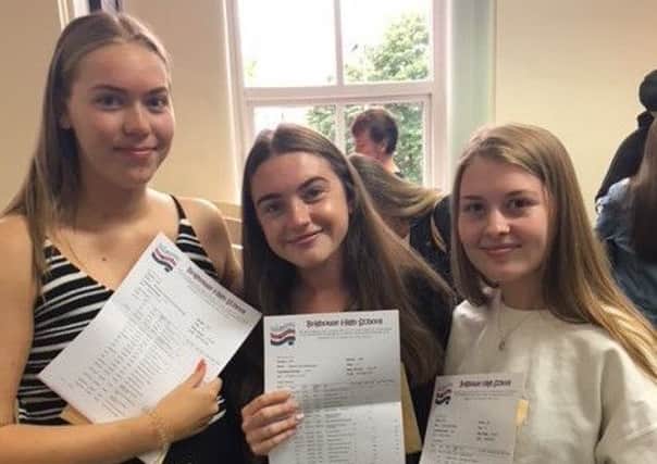 Students from Brighouse High School pick up their results
