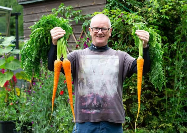 Tim Chignell, with his prize-winning carrots, at Cemetery Fields Allotments, Sowerby Bridge