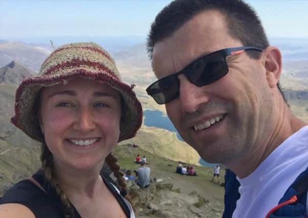 Trek: Simon Cooter with his daughter at Mt Snowden.