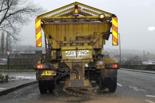 A gritter spreads salt on the district's roads ready for winter and icy conditions
