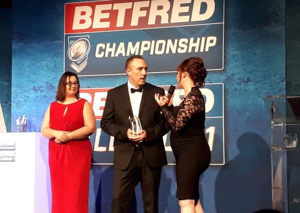 Ben Moorhouse collecting his Supporters Direct Community Champion Award at the Betfred Championship and League One Gala dinner and awards night.
