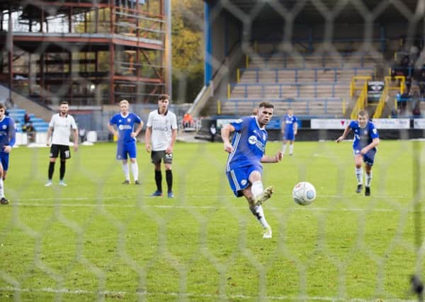Scott McManus scores for Halifax in their 3-3 home draw with Eastleigh last season