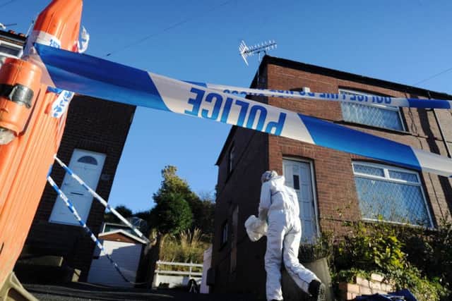 Forensic officers working in Wortley, Leeds, after a double shooting back in 2013.