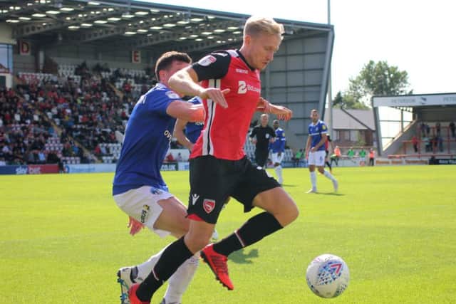 A-Jay Leitch-Smith shields the ball against Oldham.