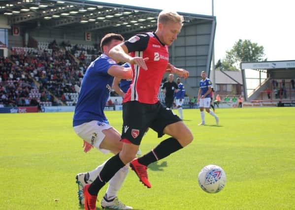 A-Jay Leitch-Smith shields the ball against Oldham.