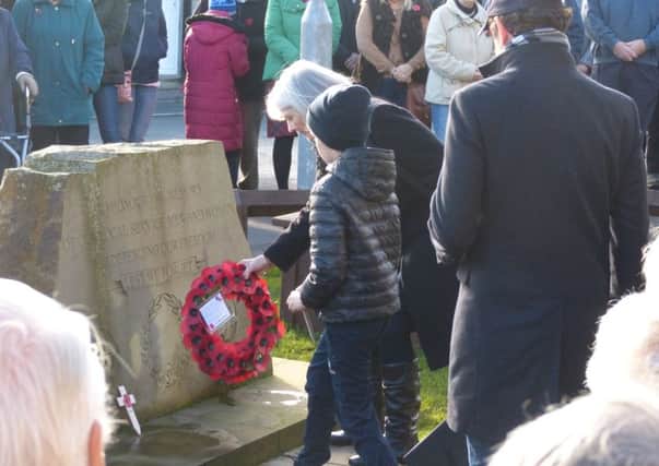 A wreath is laid at a Remembrance Service in Halifax.