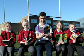 Author Tom Palmer reading one of his books with West View Primary school pupils (left to right) Katie Douglas, Rhys Blackwood, Katie Reid and Alex Griffin . Picture by FRANK REID