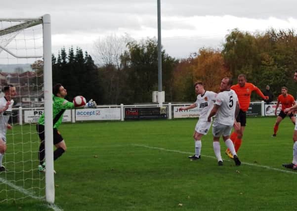 Aaron Martin heads home Brighouse's opener against Belper Town.