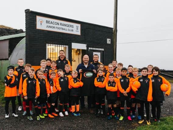 Mike Robinson, group marketing manager for Associated Waste Management Ltd, with Beacon Rangers FC