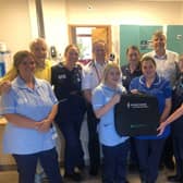 Neil Davidson with Cardiologist Simon Grant, Ward Manager Alison Coates and staff from Ward 6 at Calderdale Royal Hospital.