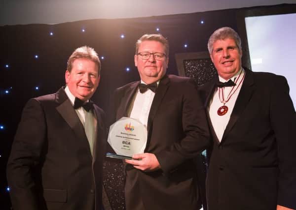 Halifax Courier Business Awards 2018 at The Venue, Barkisland. Lifetime achievement Award, from the left, sponsor Adam Slater from BCA Group, Peter Priestley collects the award on behalf of Richard Porter, and deputy lieutenant of West Yorkshire Neil Davidson.