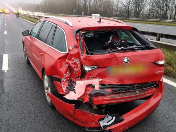 Motorists are being warned of delays up to an hour after a crash on the M62 in Huddersfield. PICS: WYP
