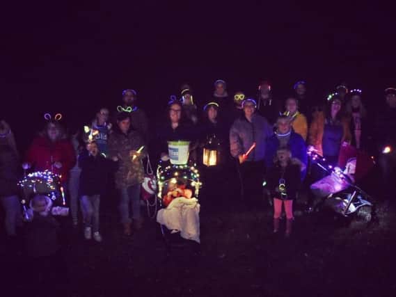 Fundraisers gathered in the park with glowsticks, flashing lights and anything bright to raise money and awareness for the charity