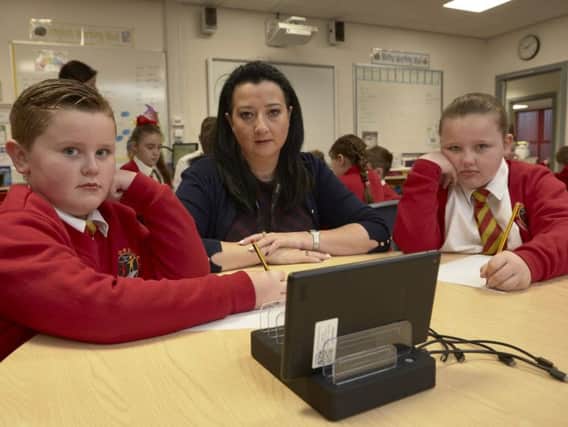 Moorside Primary School head teacher Dani Worthington with pupils Delaney Turner aged eight and Libby Mitchell aged ten.