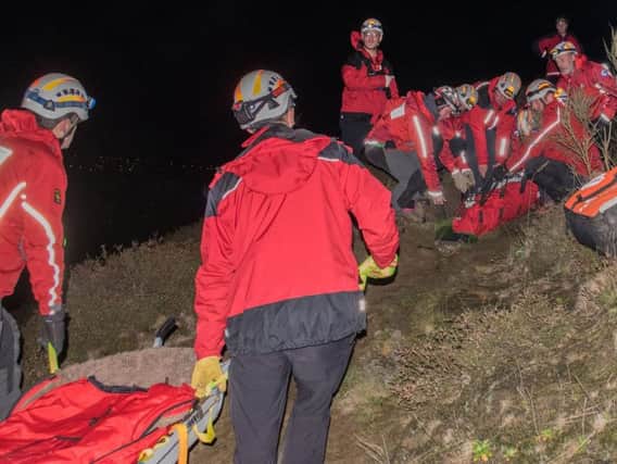 A man is taken to safety by the Calder Valley Search and rescue Team.