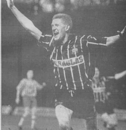 Steve Saunders celebrates his goal against West Brom. Picture courtesy of Johnny Meynell.