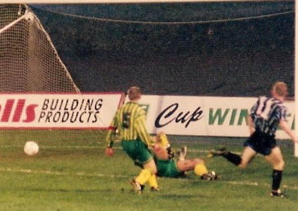 Steve Saunders scores Town's second goal against West Brom. Picture courtesy of Johnny Meynell.