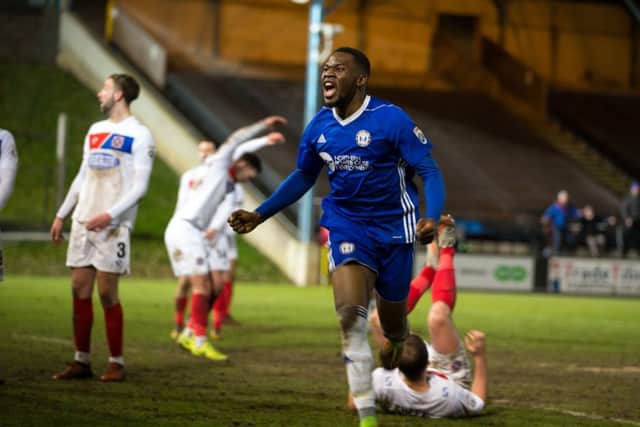 Mike Fondop-Talom celebrates one of his four goals in 12 games on loan at Town last season against Dagenham and Redbridge.