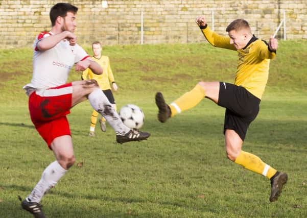 Football - Hebden Royd Red Star v Midgley United. Dan Lumb for Red Star and Toby Standring for Midgley.