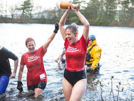 Watch swimmers dive into races at this year's New Year Swim