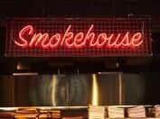 The Firepit Sportsbar and Smokehouse features neon signs and classic car parts as part of its American-style dcor.