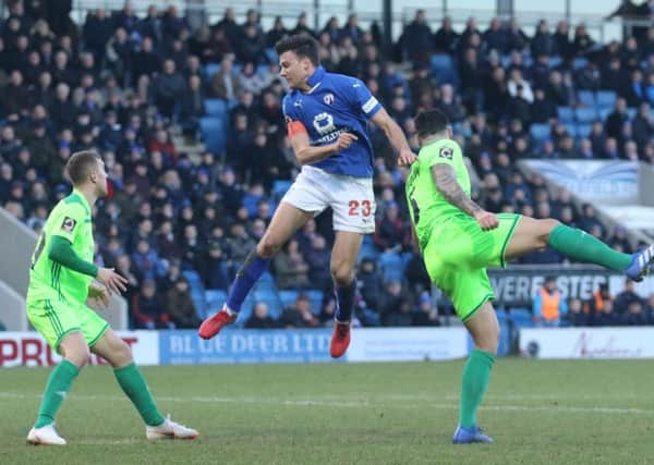 Chesterfield FC v Halifax Town, Jonathan Smith for the hosts, with Matty Brown (right)