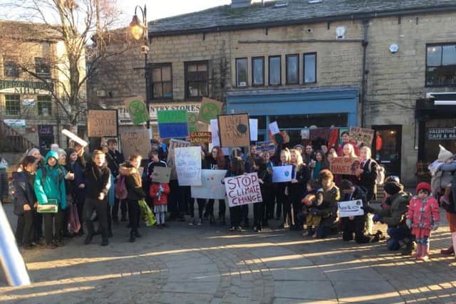 Children gather at Hebden Bridge town square at the outset of the march.