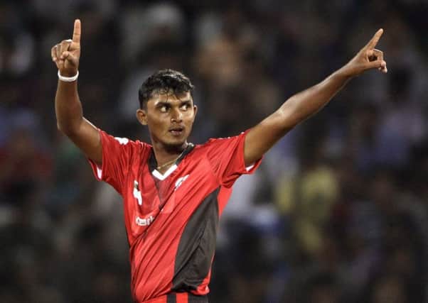 Ruhuna's bowler Alankara Asanka Silva reacts after taking the wicket of Leicestershire player Wayne White during the Champion League Twenty20 qualifying cricket match between Ruhuna and Leicestershire in Hyderabad, India, Wednesday, Sept. 21, 2011. (AP Photo/Mahesh Kumar A.)