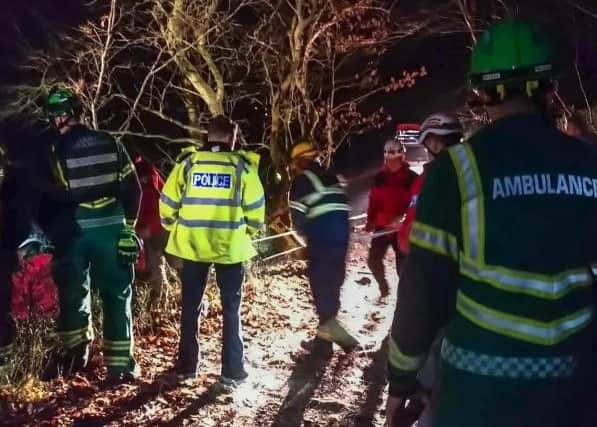 Calder Valley Search and Rescue Team shared this image of its volunteers working alongside emergency services at the scene.