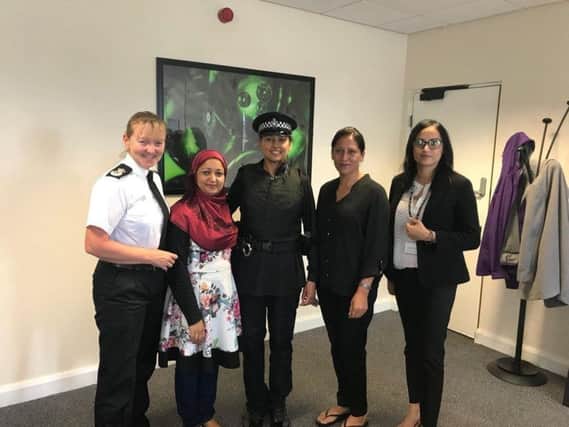 Chief Constable Dee Collins, left, with PC Fiz Ahmed, centre, modelling the alternative uniform during a meeting with the Muslim Women's Council.