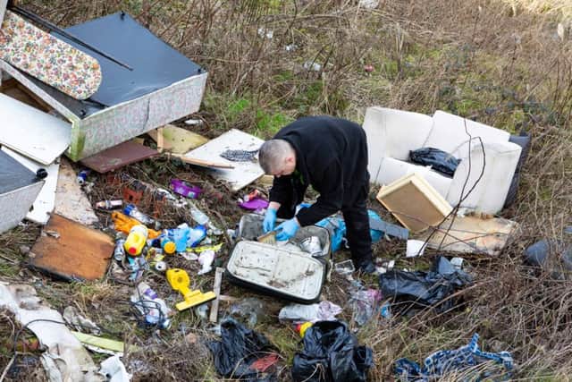 Community Safety Warden Mick Hall at a fly tipping hot spot in Pellon, on tour of Calderdale with anti-social behaviour enforcement officers in Halifax