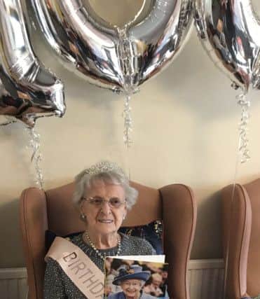 Phyllis with her card from the Queen