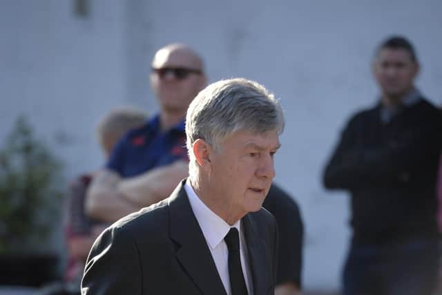 Ex-Manchester United coach Brian Kidd arrives at the funeral of Eric Harrison