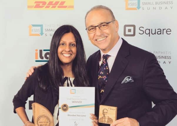 Thrilled: Babita Mistry is pictured with Theo Paphitis.