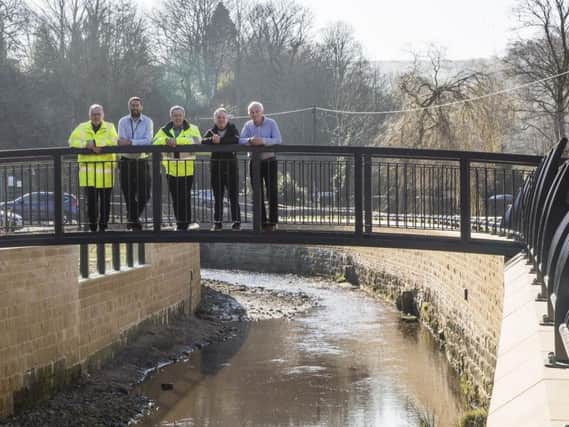 New pedestrian bridge and flood defences at Mytholmroyd. From the left, VBA senior project manager Chris Blenkam, Russell Edwards from People for Places, Environment Agency project manager Ian Waller, Mark Tupman, Environment Agency senior flood advisor, and concillor Barry Collins, cabinet member for regeneration and economic strategy.