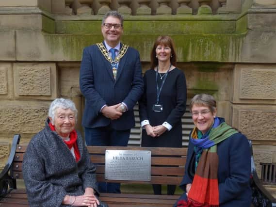 The Hilda Baruch memorial bench with (clockwise from top left) the Mayor of Calderdale, Coun Marcus Thompson; Calderdale Councils Head of HR, Jackie Addison; Coun Jane Scullion and Coun Anne Collins