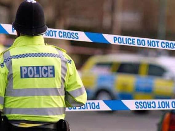 Detectives have arresting a man on suspicion of robbery in Halifax